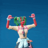 a girl with green pigtails and red horns giving a thumbs up