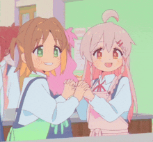 a couple of anime girls holding hands and smiling