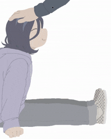 a person putting their hand on a girl 's forehead