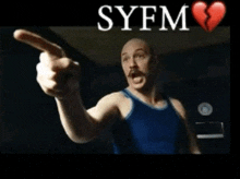 a man in a blue tank top is pointing with syfm written on the bottom