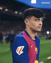 a soccer player wearing a jersey with the letter l on the sleeve