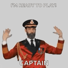 a man in a captain 's uniform is ready to play a game .