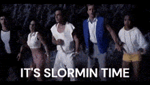 a group of people standing next to each other with the words " it 's slormin time " written above them .