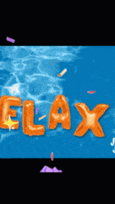the word relax is written in orange balloons in the water