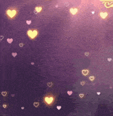 a purple background with pink and yellow hearts floating in the air