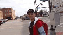a man wears a hat that says balanced