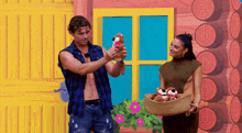 a man holding a stuffed animal next to a woman holding a basket full of stuffed animals