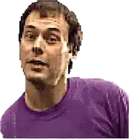 a man wearing a purple shirt looks at the camera