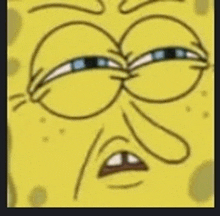 a close up of a cartoon character 's face with a spongebob squarepants face .