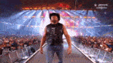 a man in a cowboy hat is walking down a ramp in front of a crowd with peacock in the background