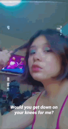 a girl is holding a cell phone and asking would you get down on your knees for me ?