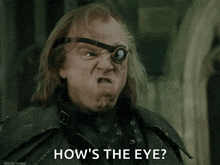 a man with a goggles on his eye is asking how 's the eye