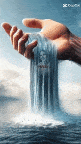 a hand holding a waterfall with a picture of a woman on it
