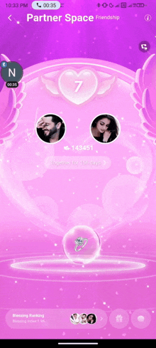 a phone screen shows a purple background with a heart and the number 7 on it