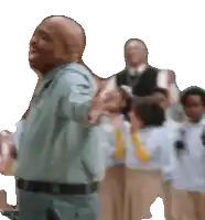 a man is standing in front of a group of children with his arms outstretched
