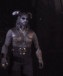 a man with horns and a beard is wearing a leather vest