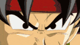 a close up of a cartoon character 's eyes with a red headband
