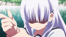 a girl with white hair covering her face with her hand