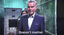 a man in a suit says " doesn 't matter " in front of a woman