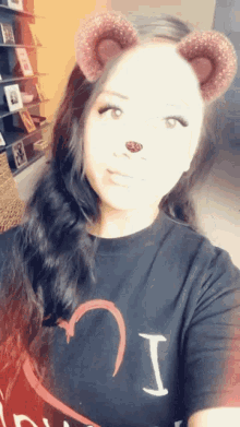 a woman wearing a t-shirt that says i on it