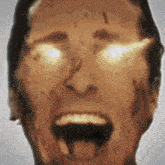 a close up of a man 's face with his mouth open .