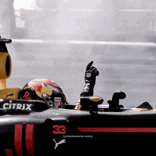 a man in a race car with the word citrix on the side