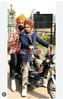 two men are riding a motorcycle with a license plate that says tr 65b g