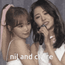 a couple of girls standing next to each other with nil and claire written on the bottom