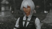 a woman in a suit and tie has a heart shaped object in her eye