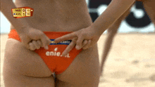a woman in a bikini with the word enie on the back
