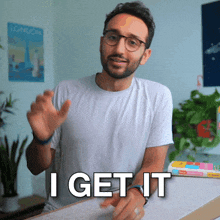 a man wearing glasses and a white shirt says " i get it "