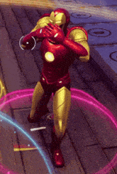 a man in a red and gold superhero suit is standing on a wooden floor
