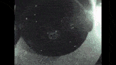 a close up of a black object with a white circle on it