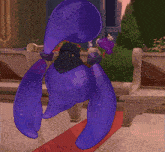 a purple cartoon character is sitting on a red carpet