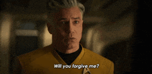 a man in a yellow shirt is asking if he can forgive himself