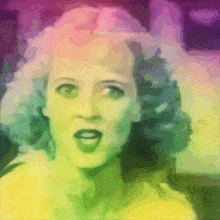 a colorful painting of a woman 's face with a yellow top