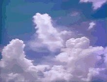 a blue sky with purple clouds in it .