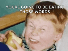 a child is eating a sandwich with the words " youre going to be eating those words "