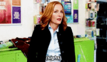 a woman in a blue jacket says sighs in a pixelated image