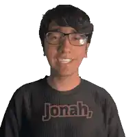 a man wearing glasses and a black shirt that says jonah on it