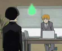 a man in a suit is sitting at a desk with a laptop and a green glowing object above him