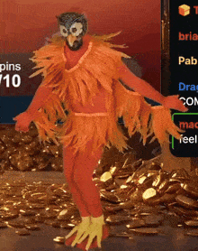 a man in an orange bird costume is standing in front of a pile of gold coins