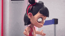 a cartoon girl is standing in front of a machine with her hands outstretched .