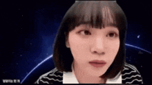 a woman with short hair is making a funny face while looking at the camera .