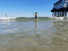 waves beach ocean boardwalk crash