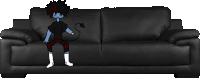 a devil is sitting on a black leather couch