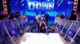 a wrestling match is taking place in front of a smack down sign