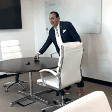 a man in a suit stands in front of a white board that says " before "