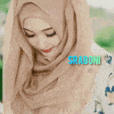 a woman wearing a hijab with the words wow written on the bottom