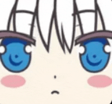 a close up of a cartoon girl 's face with blue eyes and a pink cheek .